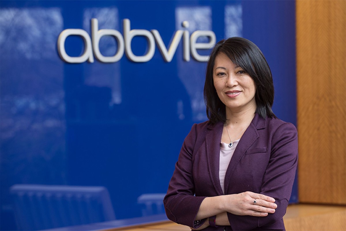 Betty Yao in front of a navy AbbVie background.